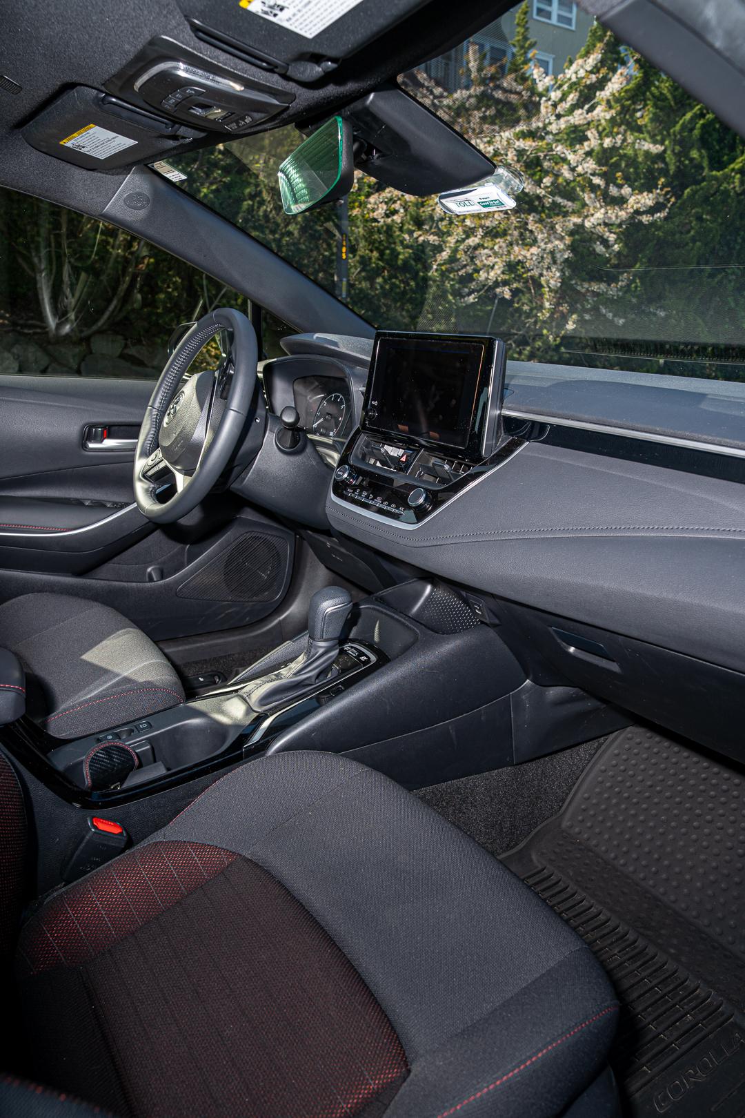 Interior view of a Corolla's dashboard showing steering wheel